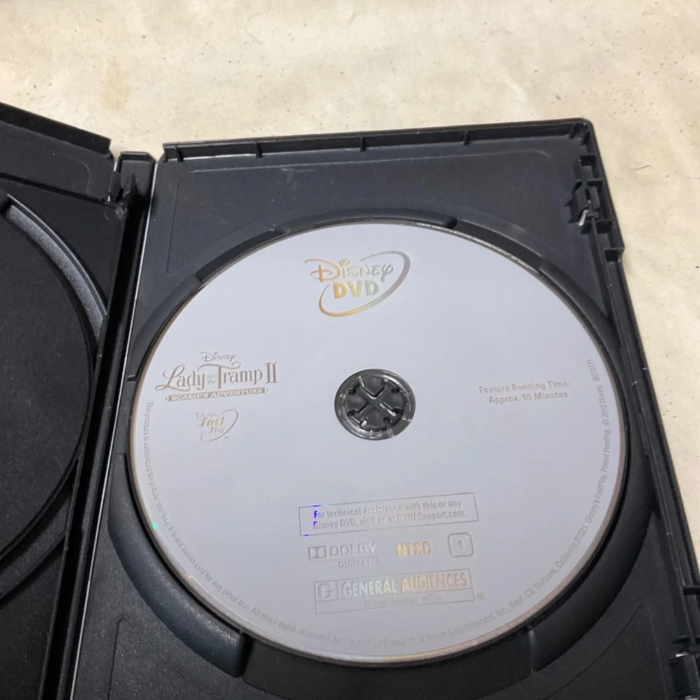 DVD and Blu Ray Disc - Lady and the Tramp II.    V107